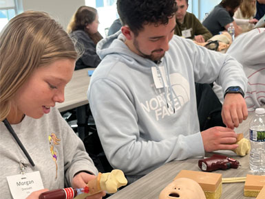 Two students working at table on disaster training day 